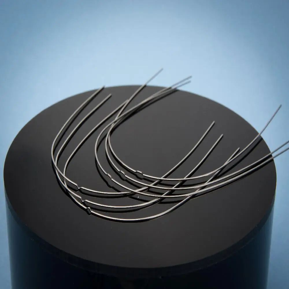 Fil de mémoire super élastique activé par la chaleur NiTi Nitinol à haute température AF pour l'orthodontie Fil de mémoire super élastique activé par la chaleur NiTi Nitinol à haute température AF pour l'orthodontie