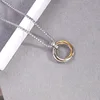 Aleación de triple anillo [oro]