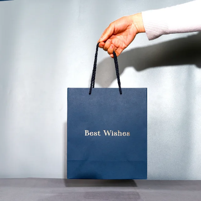 Customized Blue Business Paper Bag Luxury Gold Foil Logo Simple Solid Color Clothing Shopping Packaging Bag for Supermarket Use
