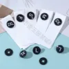 Bouton noir blanchi en coton mat