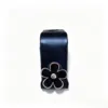 Petits crochets marguerite noirs [en sachet]