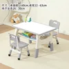 Whiteboard, gray table, two chairs