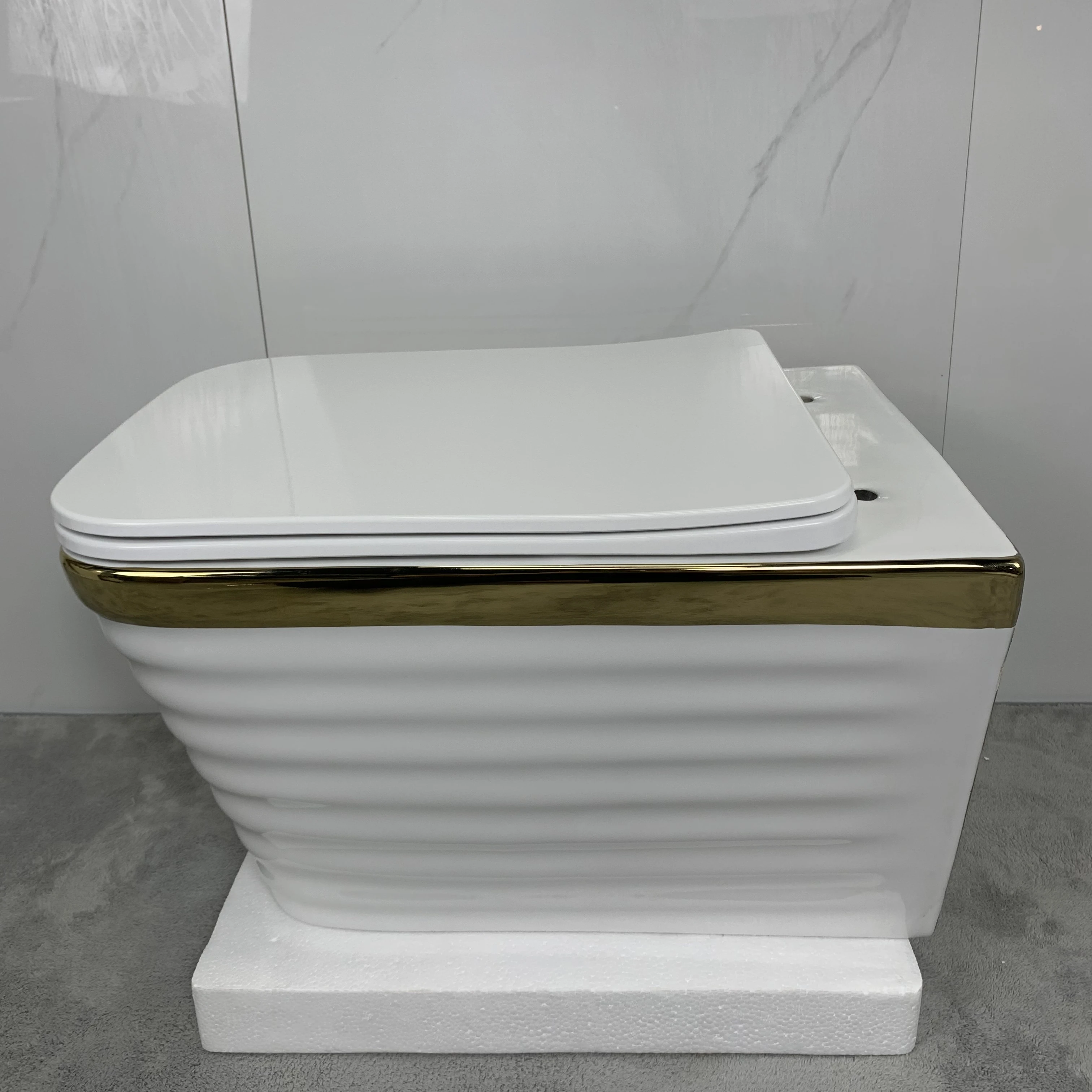 Ceramic luxury design sanitary ware european wall hung wc bathroom suites gold plating bidet toilet set manufacture