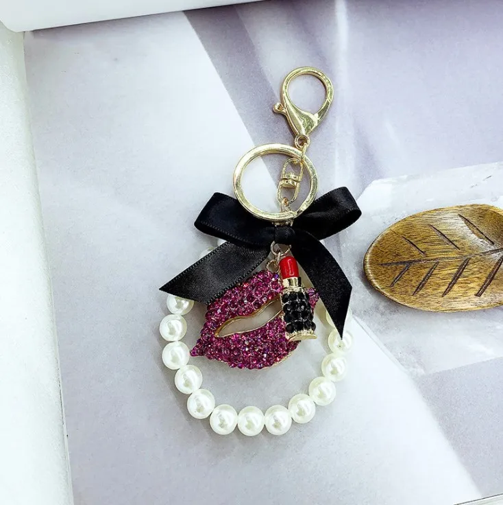 Wholesale Women Pearl Flower Charm Key Chain Strap Lipstick Bottle