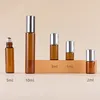 Amber bottle + steel roller ball + silver aluminum cap
