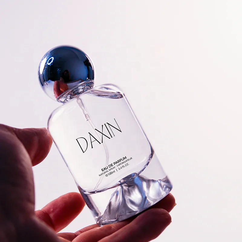 OEM/ODM 30ml 50ml 100ml Cylinder Glass Perfume Bottles with Gold Silver Blue Red Green Bottom for Gift Fragrance