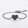 Pulsera de cadena con cruz y corazón con agujero interior negro
