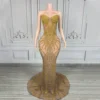 Maglia nuda con pietra dorata