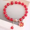 Bracciale margherita con perline rosse di popcorn