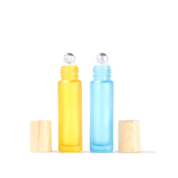 Hot-selling Custom Yellow and Blue  Frosted Perfume Glass Roll on Essential Oil Bottles With Wood Grain Lid