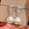 Boucles d'oreilles perles blanches