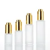 Frosted bottle with gold tops