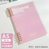 Quaderno ad anelli A5 a dieci fori - rosa con pagine a righe