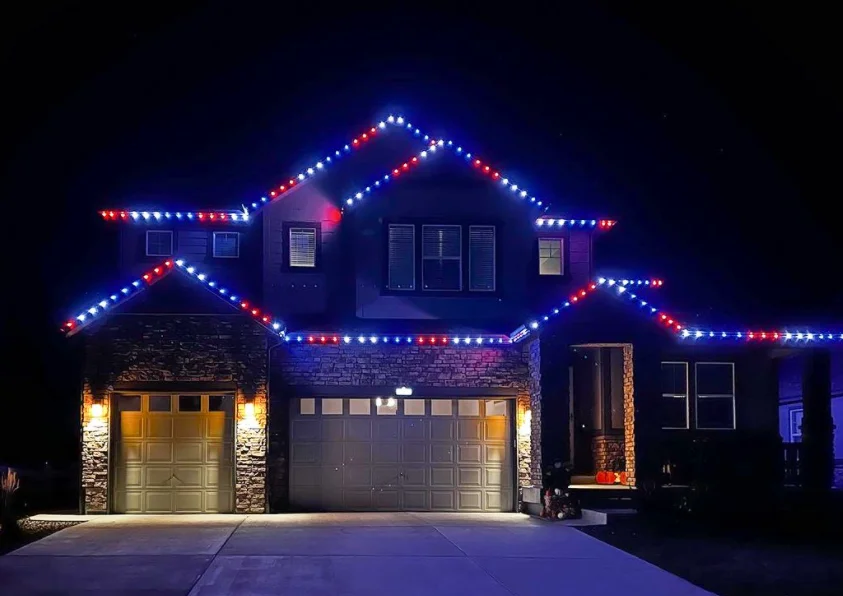 House at night with pink EverGlow LED lights for special event