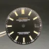 S borchie in oro nero