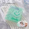 Visage souriant vert