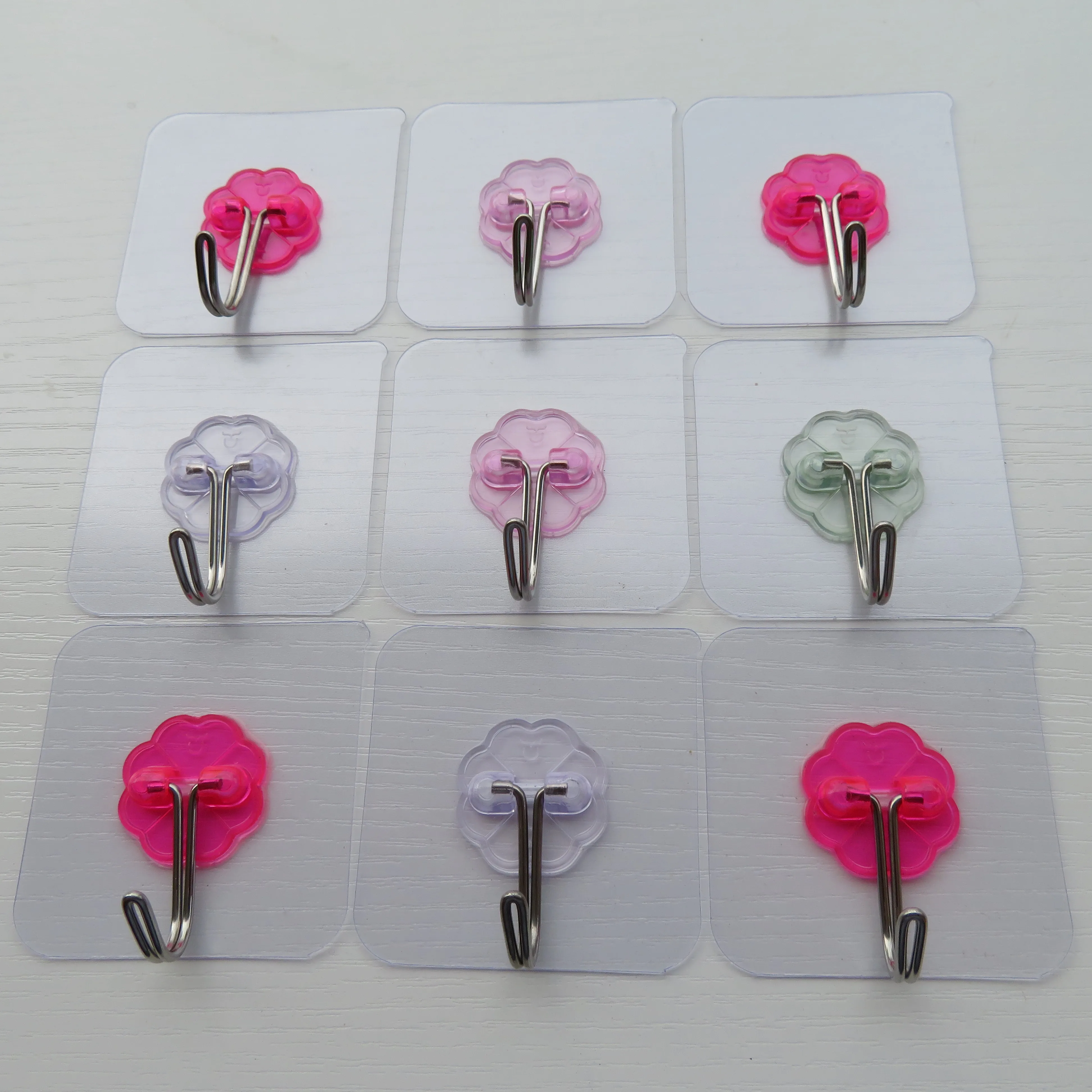 Can process and customize a variety of color plum pieces of metal traceless novelty hooks factory direct sales supplier