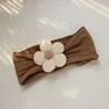 Fascia per capelli jacquard marrone con petali beige