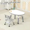 Whiteboard, gray table and chair