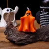 Embrace the orange ghost scented candle