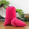 Sac en velours avec cordon de serrage rouge rose