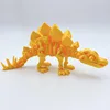 18cm long golden stegosaurus