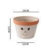 Smiley gris-cemento mediano 16cm