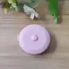 Cinta métrica de 2 metros en pulgadas, color rosa claro.