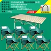 A beige 120cm long table with 6 green low moon chairs