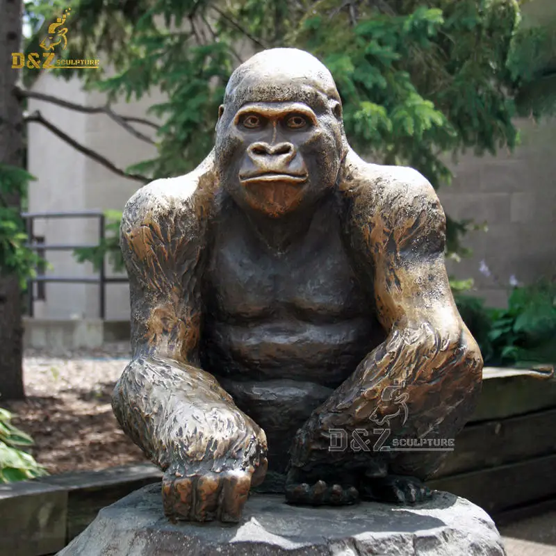 large bronze gorilla statue person sitting