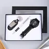 set regalo composto da orologio nero, penna e portachiavi