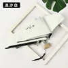 Flat, five-fold, off-white, black coated