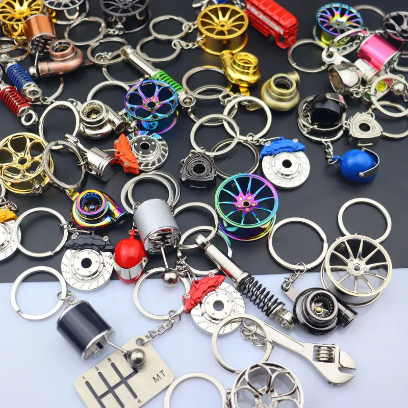 Set De 5 Llaveros De Metal Con Formas De Piezas De Coche - Turbo, Disco De Freno, Llanta, Palanca Y Amortiguador, Color Azul