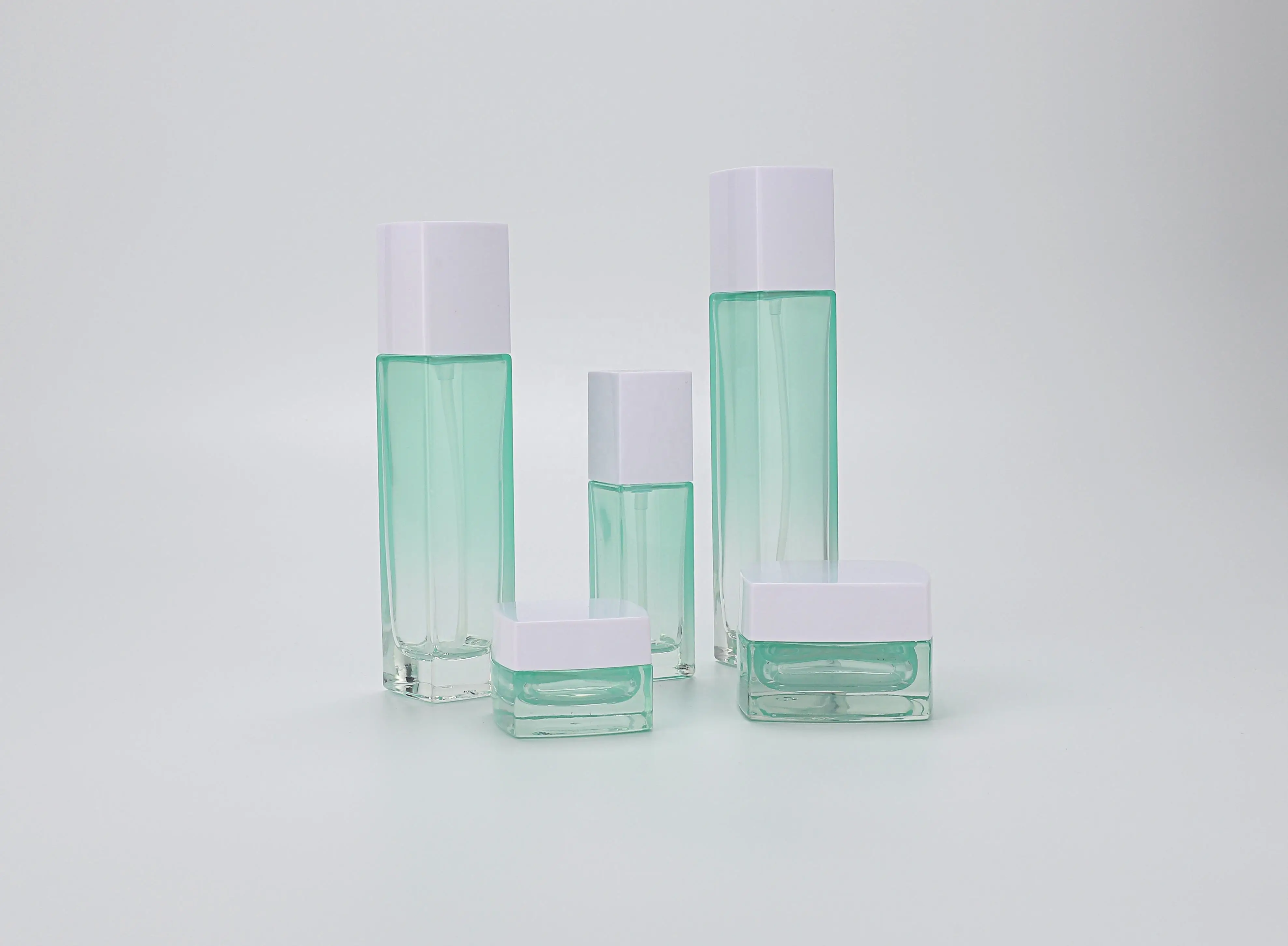 Custom square cosmetic glass bottle packaging cosmetic set lotion toner serum jar skincare packaging with pump manufacture