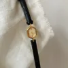 Black belt gold frame gold face