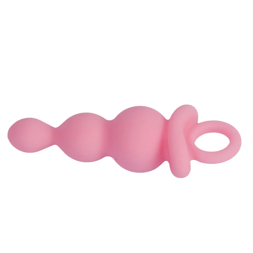 Pink silicone butt plug with measurement scale