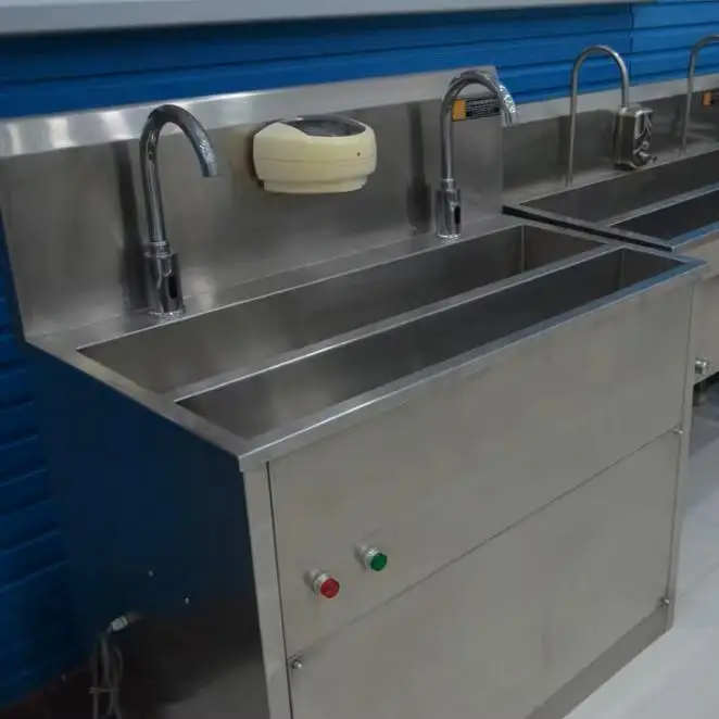 Industrial locker room equipment with stainless steel lockers and sanitation stations