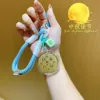 Pendentif "Que la Lune soit plus brillante" avec cordon bleu.