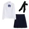 Ensemble femme manches longues + nœud papillon, chaussettes hautes noires, jupe.