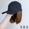 Black hat, collarbone-length hair - light brown