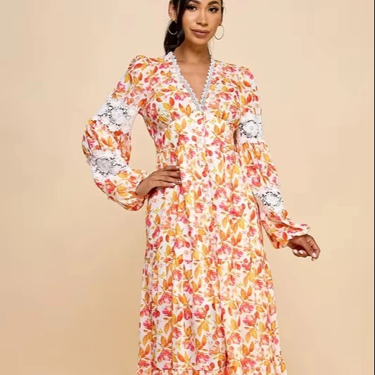 A Long Dress For Women Featuring Vibrant Floral Prints, Cutouts, And Lace Trim. - Image 1