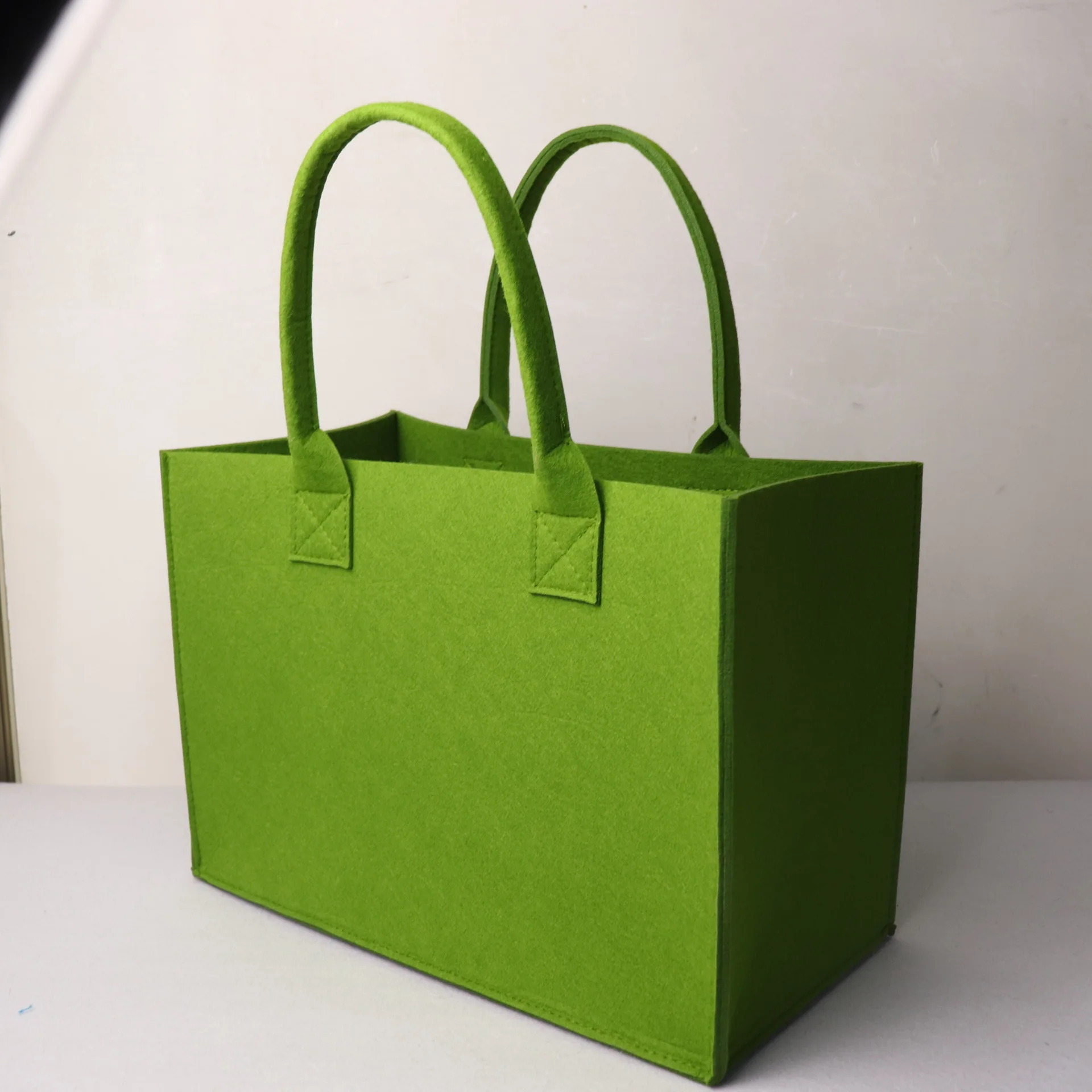 Green felt high quality bag, made by people with disabilities