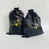 Black satin drawstring bag
