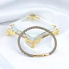 Chiusura oro + vera pelle di pecora marrone