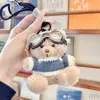 Khaki bear blue sweater lanyard glasses