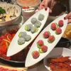White long strip of shrimp balls plate
