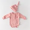 conjunto de pelele rosa para bebé