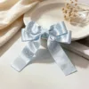 Blue polka dot bow hair clip