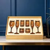 A set of eight dazzling amber champagne and red wine beverage glasses