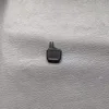 One on the left side of the driver's seat
